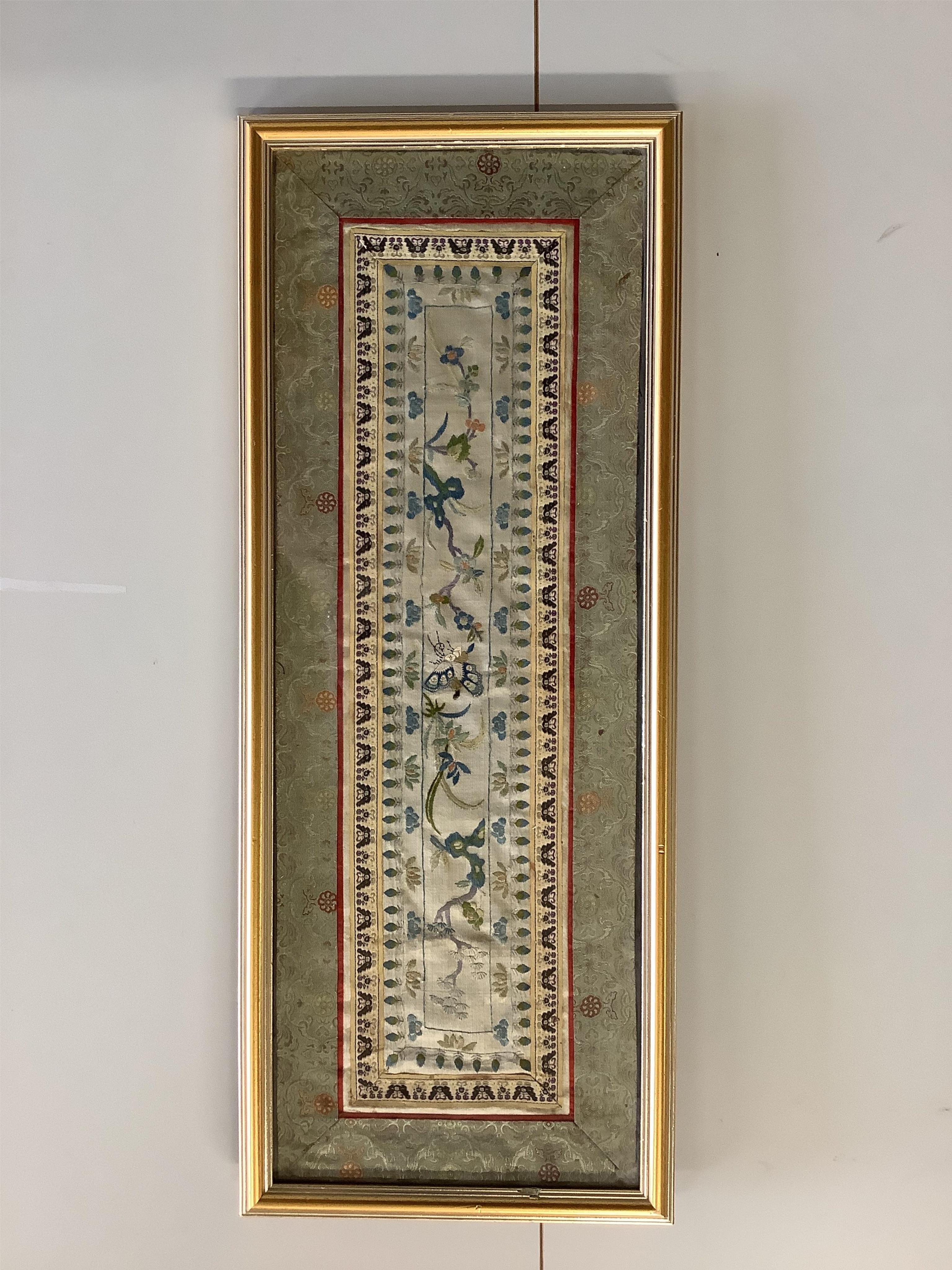 A Chinese framed Kesi gold dragon embroidery, probably originally part of a robe, together with a Chinese framed silk embroidered butterfly sleeve band, both items edged with narrow silk braiding and bordered with silk b